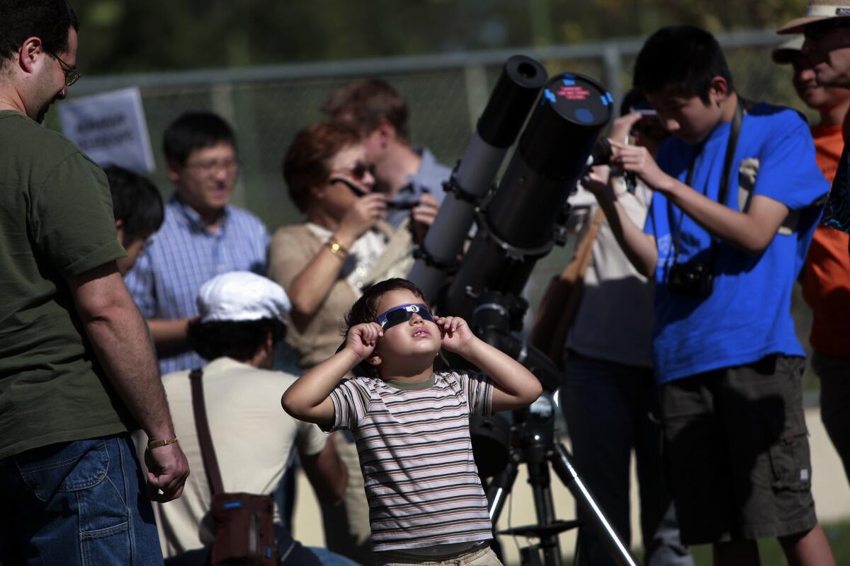 Skywatchers gathered at the Caltech campus for the transit of Venus in 2012. The university opens its grounds again this year for the partial eclipse. (Jay L. Clendenin / Los Angeles Times)