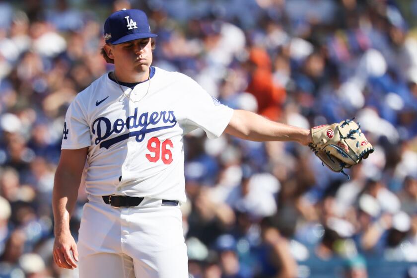 LOS ANGELES, CALIFORNIA - OCTOBER 14: Landon Knack #96 of the Los Angeles Dodgers reacts.