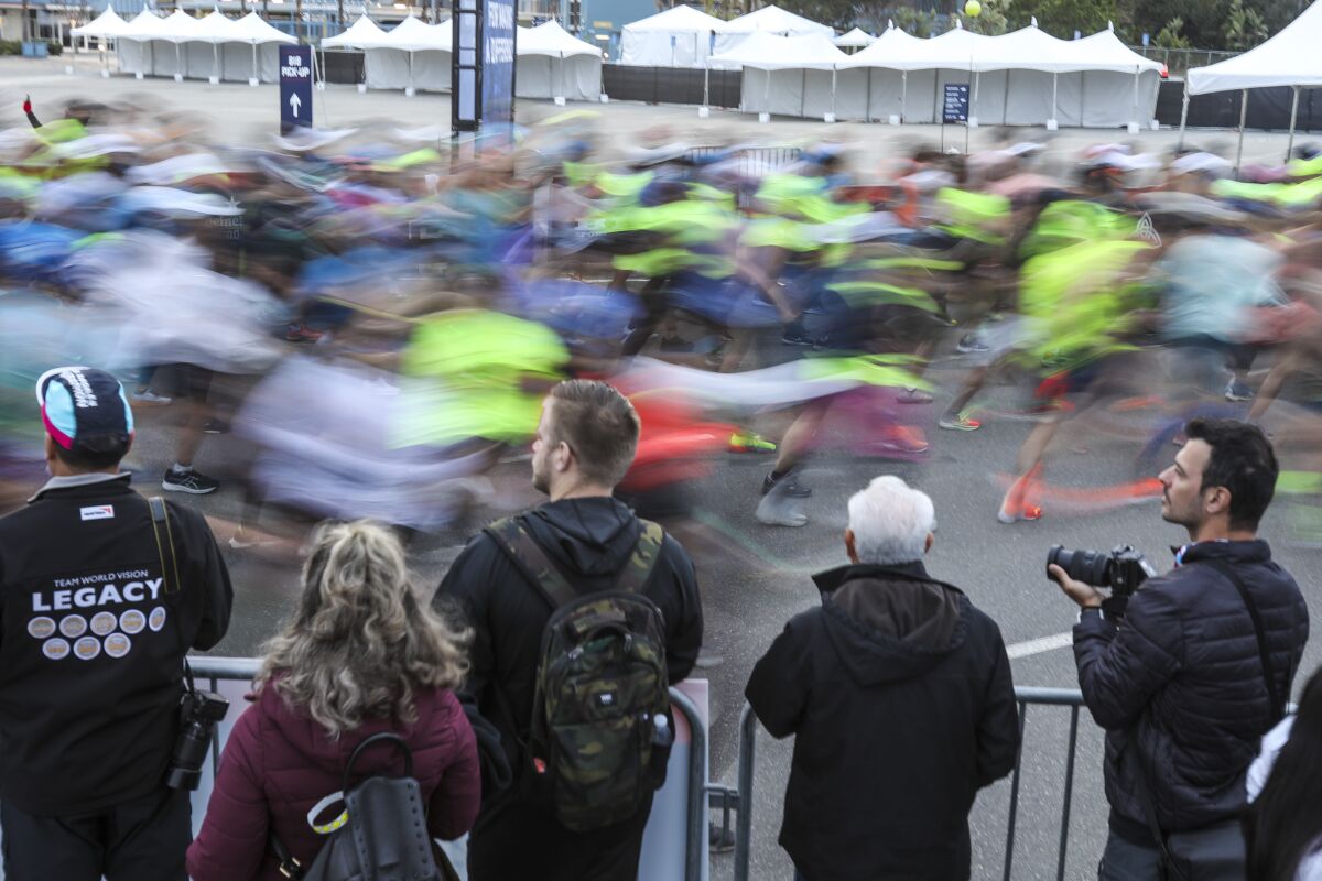 Spectators watch a blur of runners in the L.A. Marathon.