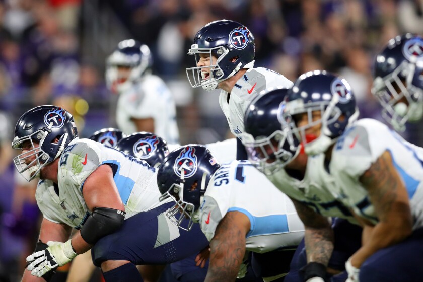 Titans quarterback Ryan Tannehill gets set for the snap during an AFC divisional playoff game against the Ravens on Jan. 11 at M&T Bank Stadium.