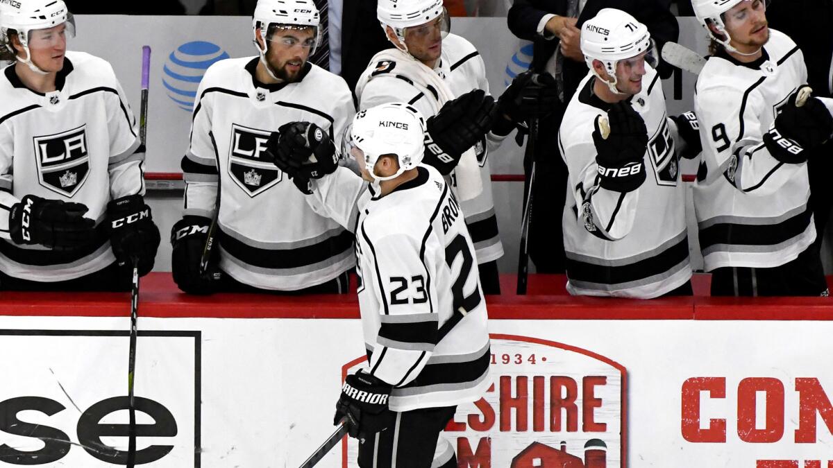 Kings right wing Dustin Brown celebrates with teammates after scoring against the Chicago Blackhawks in the third period.