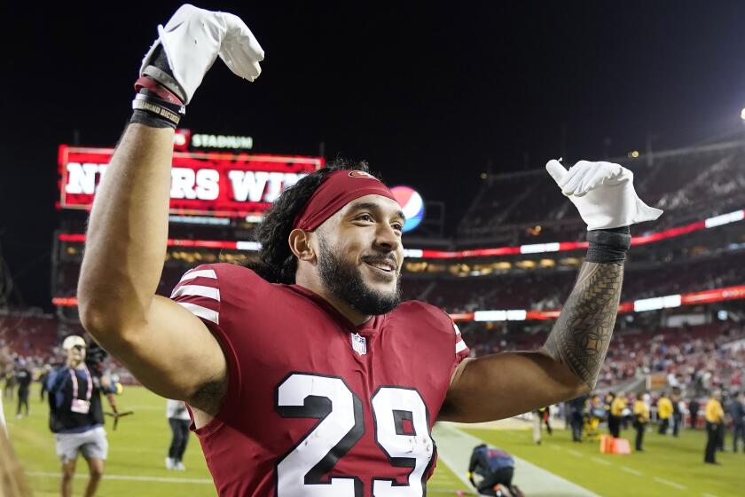 San Francisco 49ers safety Talanoa Hufanga (29) celebrates after an NFL football game.