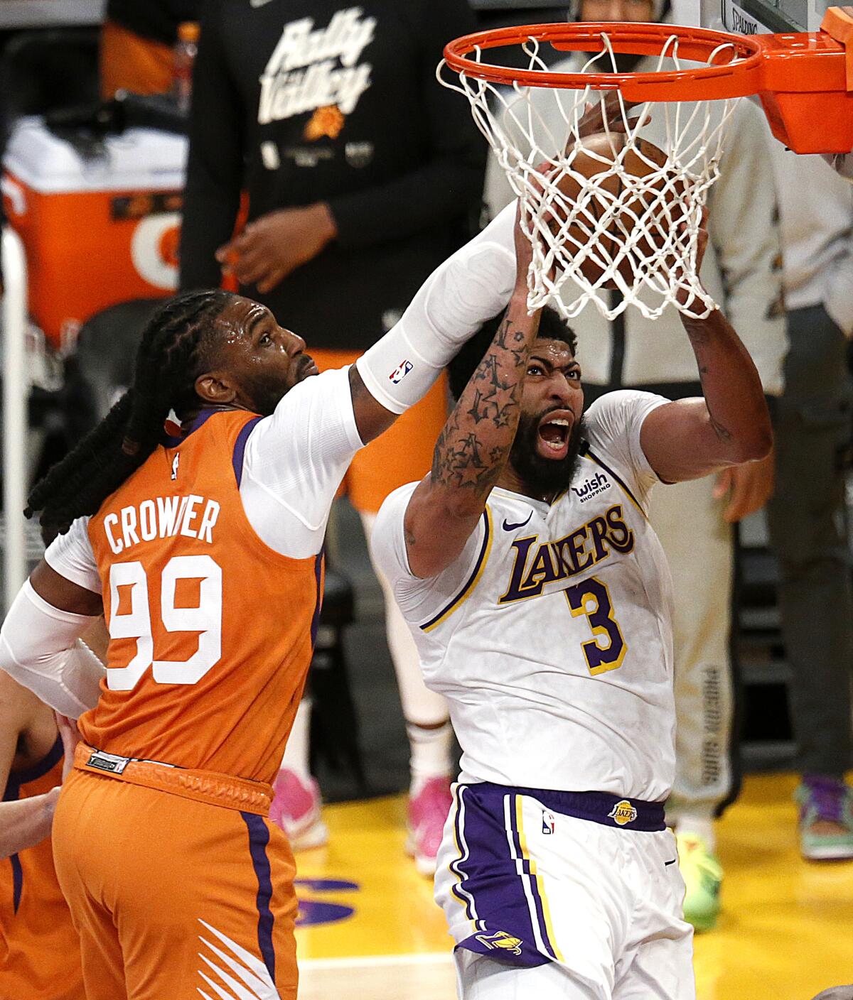 Lakers forward Anthony Davis misses a layup in front of Phoenix Suns forward Jae Crowder.