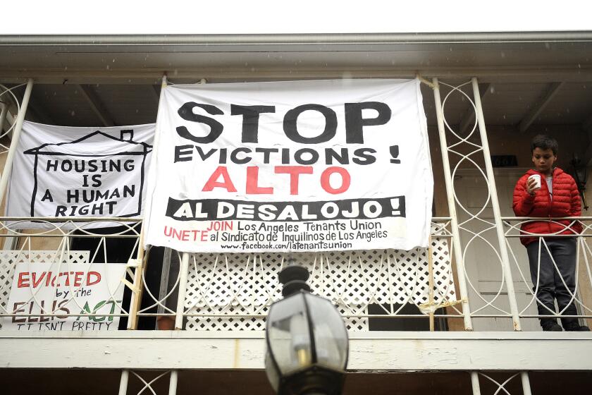 Christina House  Los Angeles Times ANTI-EVICTION signs festoon the Rodney Drive Apartments during a January 2016 protest.