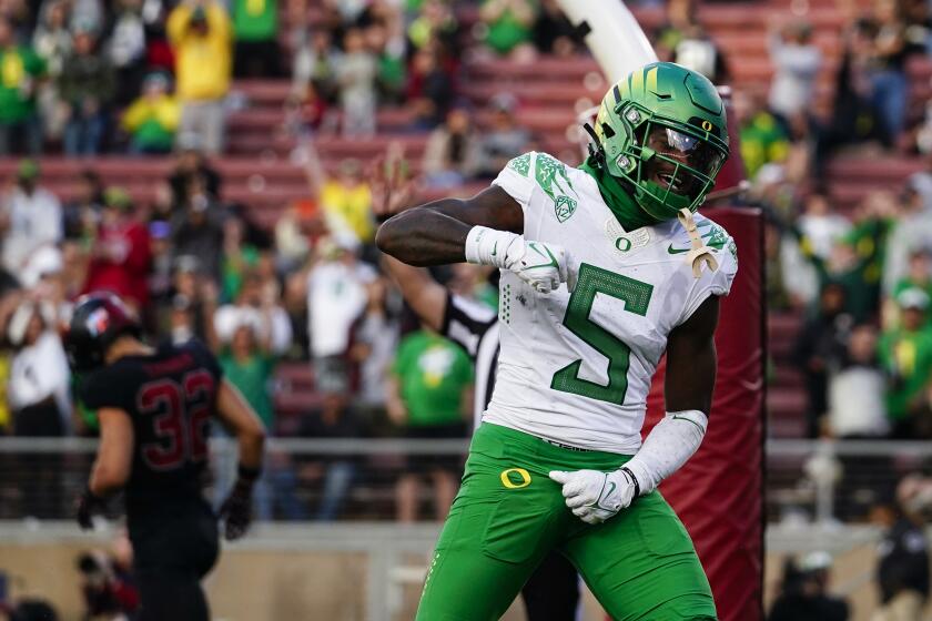 Oregon wide receiver Traeshon Holden celebrates after scoring a touchdown against Stanford during the second half of an NCAA college football game, Saturday, Sept. 30, 2023, in Stanford, Calif. (AP Photo/Godofredo A. Vásquez)