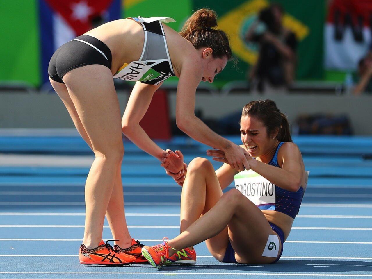 Nikki Hamblin of New Zealand stops running during the Women's 5000m Round 1 race to help fellow competitor Abbey D'Agostino of the USA after they collided. D'Agostino stopped her race, shook Hamblin's shoulder and said "Get up, get up, we have to finish this." Both runners, who had never met before, went on to finish.