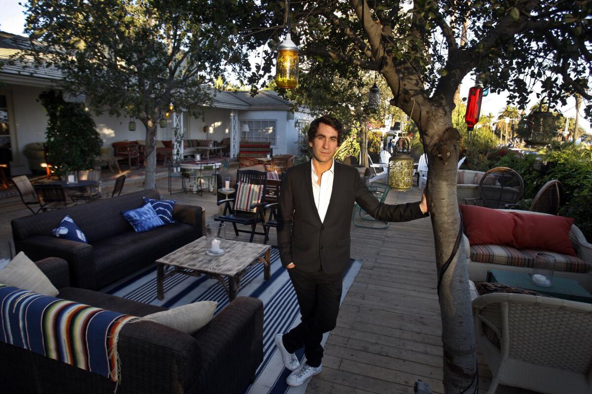 Brent Bolthouse stands on the patio of The Bungalow in Santa Monica.