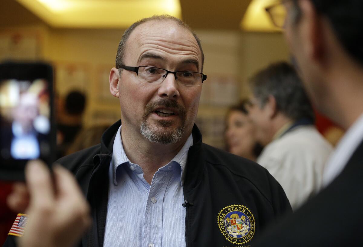 Gubernatorial candidate Tim Donnelly speaks to reporters at the California Republican Party 2014 Spring Convention on March 14 in Burlingame, Calif.