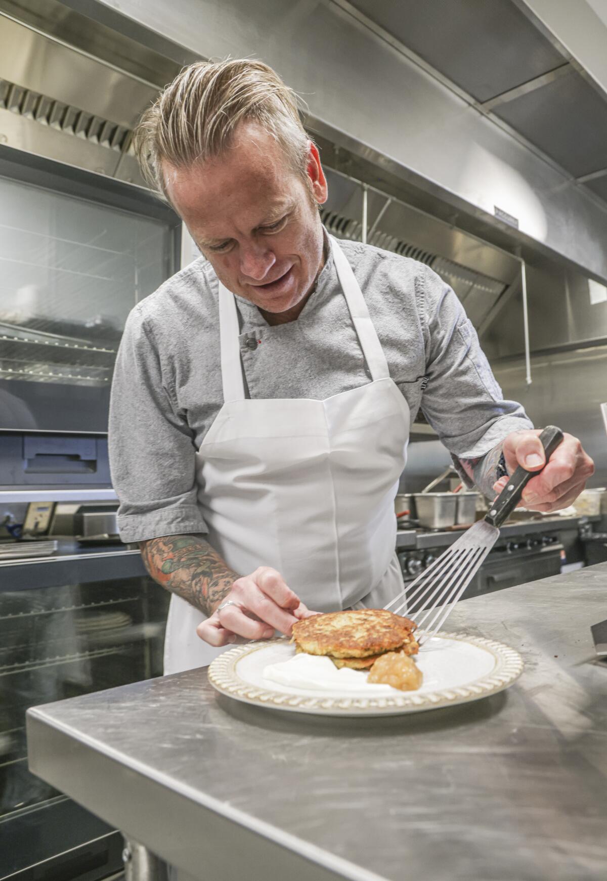 Chef Jeff Armstrong works on a new dish in La Jolla in 2022.