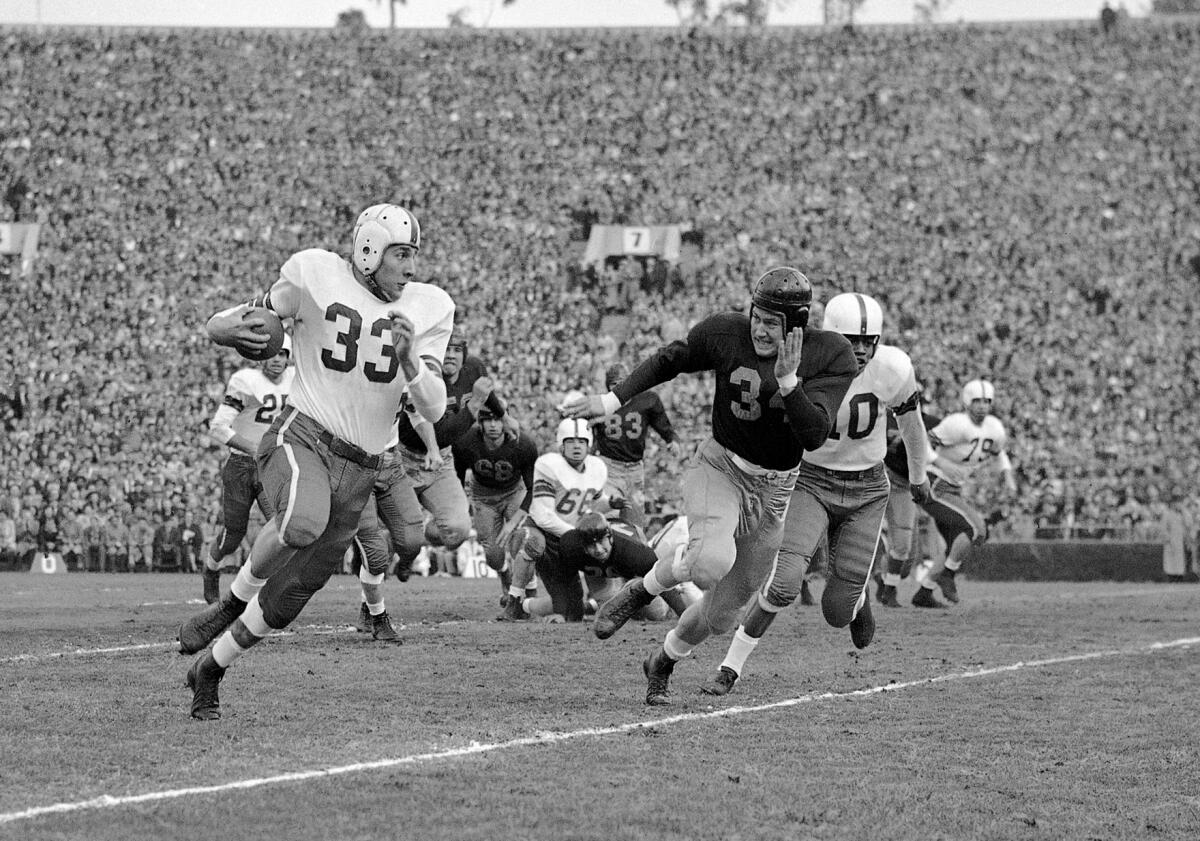 Ohio State fullback Fred Morrison tries to run past California's Paul Baldwin during the 1950 Rose Bowl.