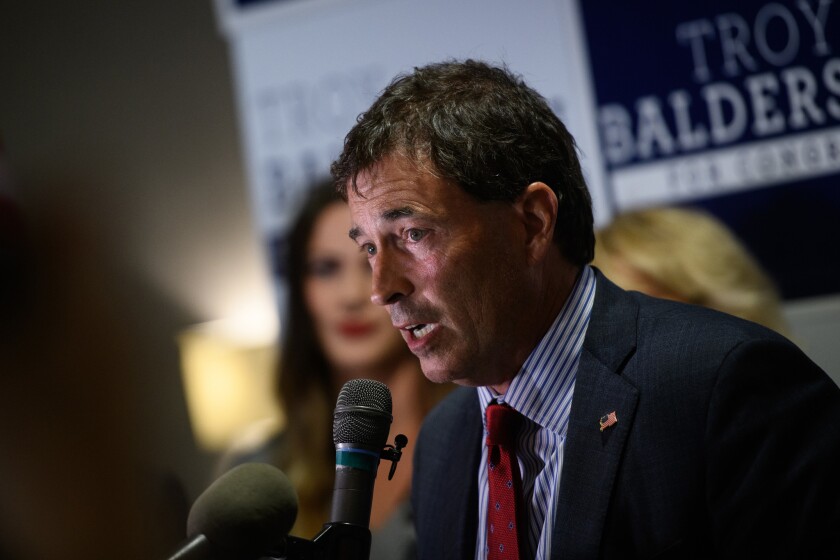 Republican congressional candidate Troy Balderson claims victory in a speech at his election watch party in Newark, Ohio. But the race between Balderson and Democratic challenger O'Connor was left too close to call.
