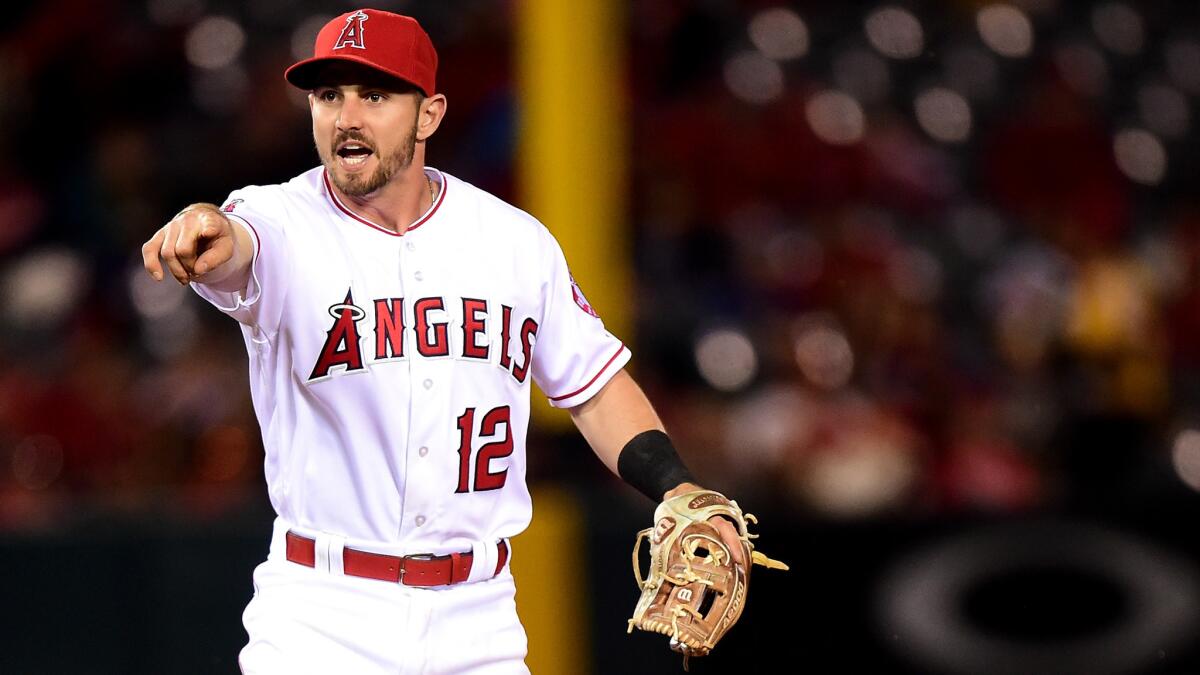 Angels second baseman Johnny Giavotella reacts as Tampa Bay's Steven Souza Jr. takes second base after a throwing error during the ninth inning Saturday night.