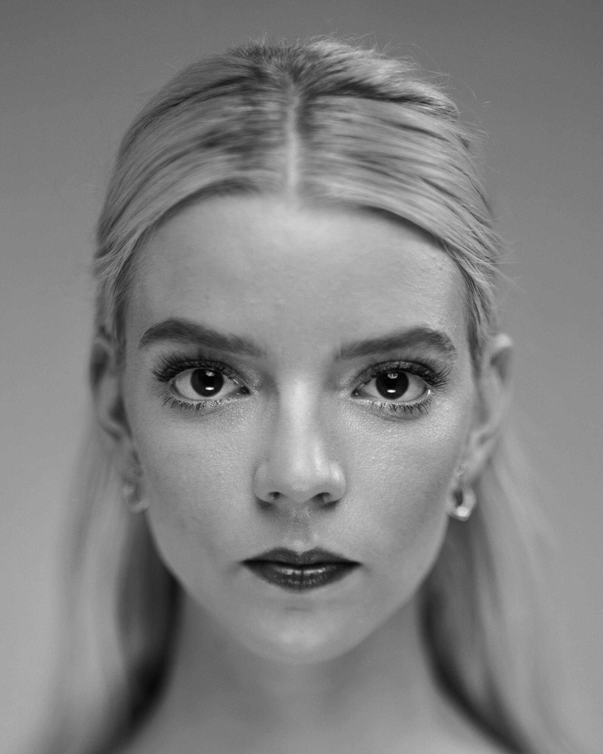 Anya Taylor-Joy looks straight ahead with a serious expression