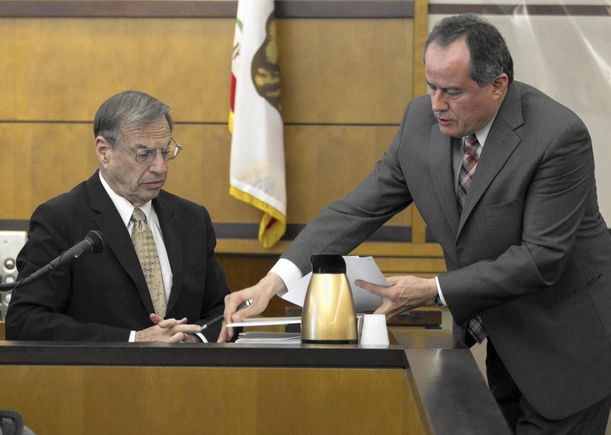 Former San Diego Mayor Bob Filner, left, and plaintiff’s attorney Manuel Corrales Jr. in court on March 28. Filner was asked whether he had the authority to hire and fire city employees who worked outside his office.