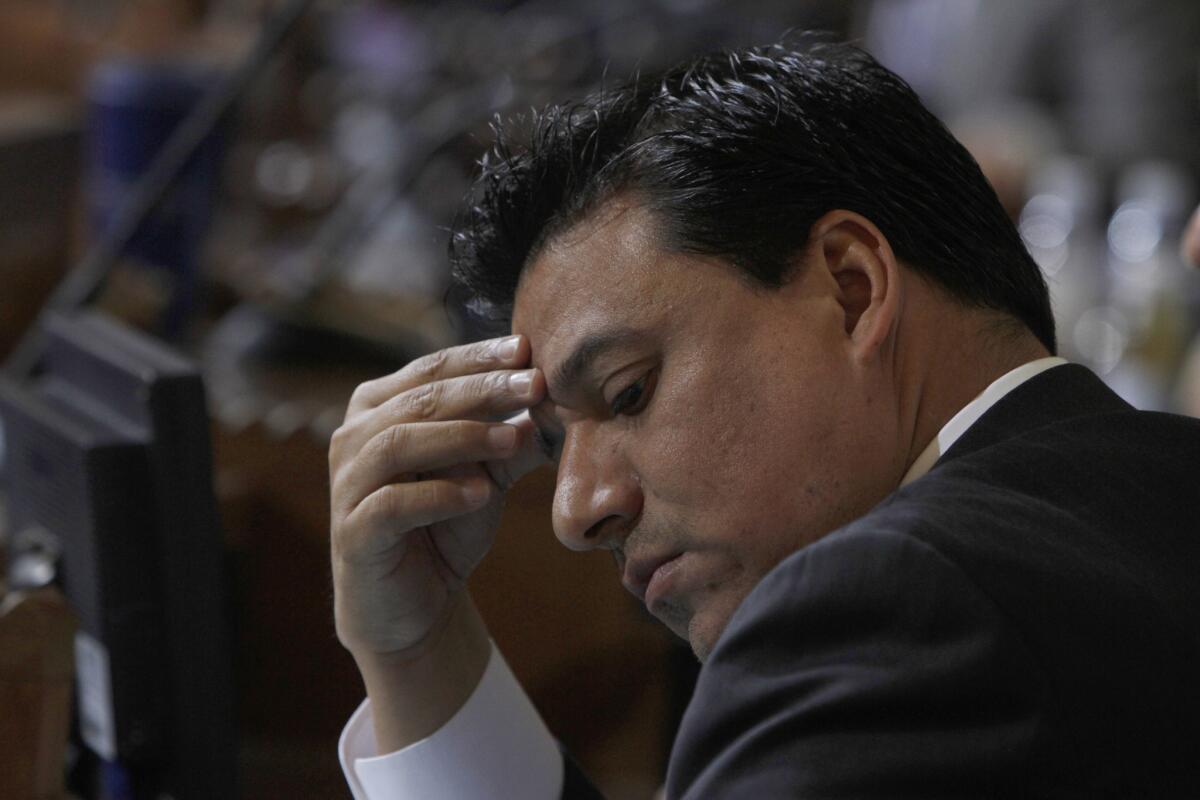 Los Angeles City Councilman Jose Huizar, shown at a council meeting in 2014. He is facing a felony racketeering charge.