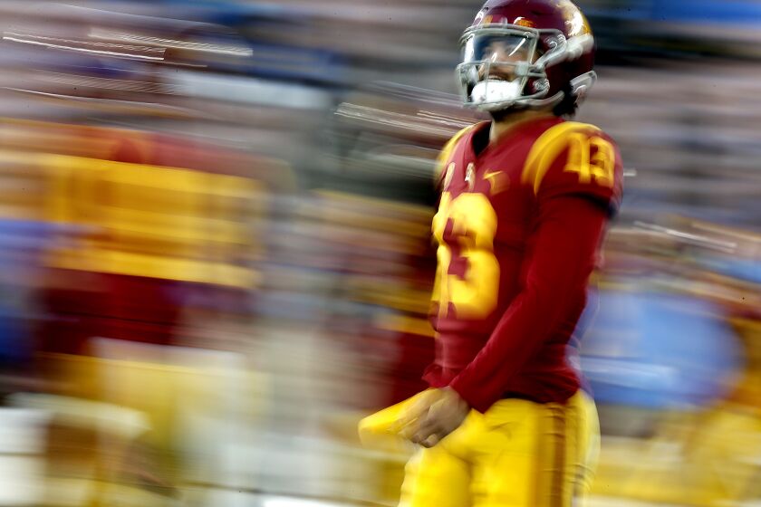 USC quarterback Caleb Williams warms up before playing against UCLA