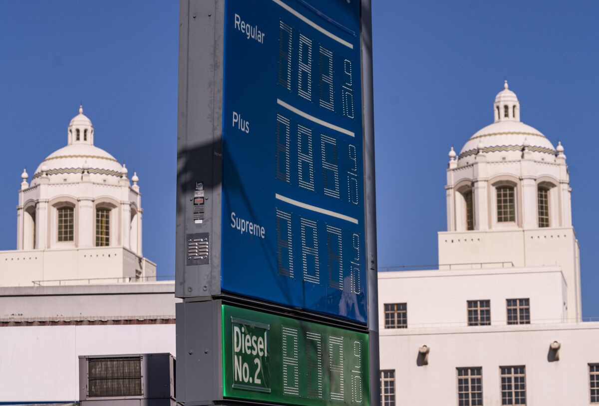 FILE - Various grades of gasoline, with prices above seven dollars per gallon, are displayed at a Chevron gas station, May 22, 2022, in downtown Los Angeles. Americans cut their spending unexpectedly in May compared with the month before, underscoring how surging inflation on daily necessities like gas is causing them to be more cautious about buying discretionary items. (AP Photo/Damian Dovarganes, file)