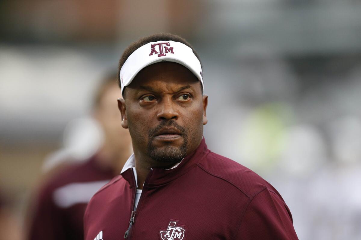 Texas A&M Coach Kevin Sumlin looks at the scoreboard prior to a game against Mississippi.