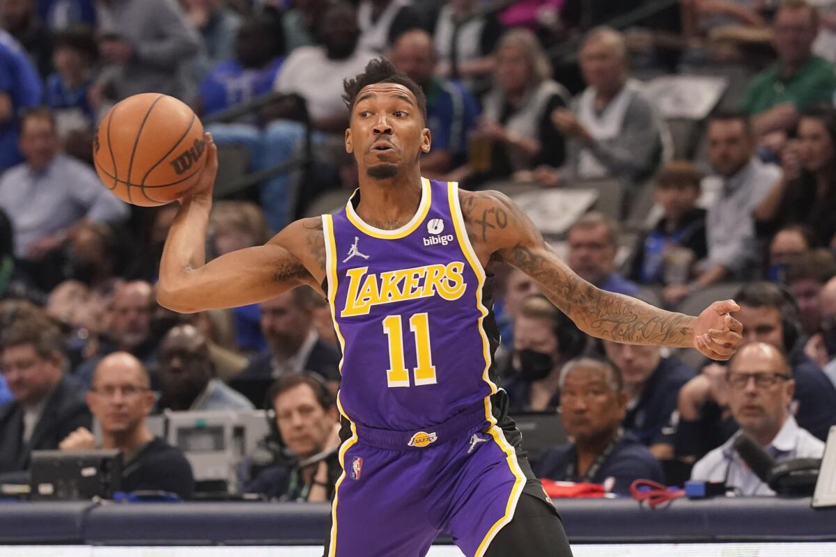 Lakers guard Malik Monk passes.