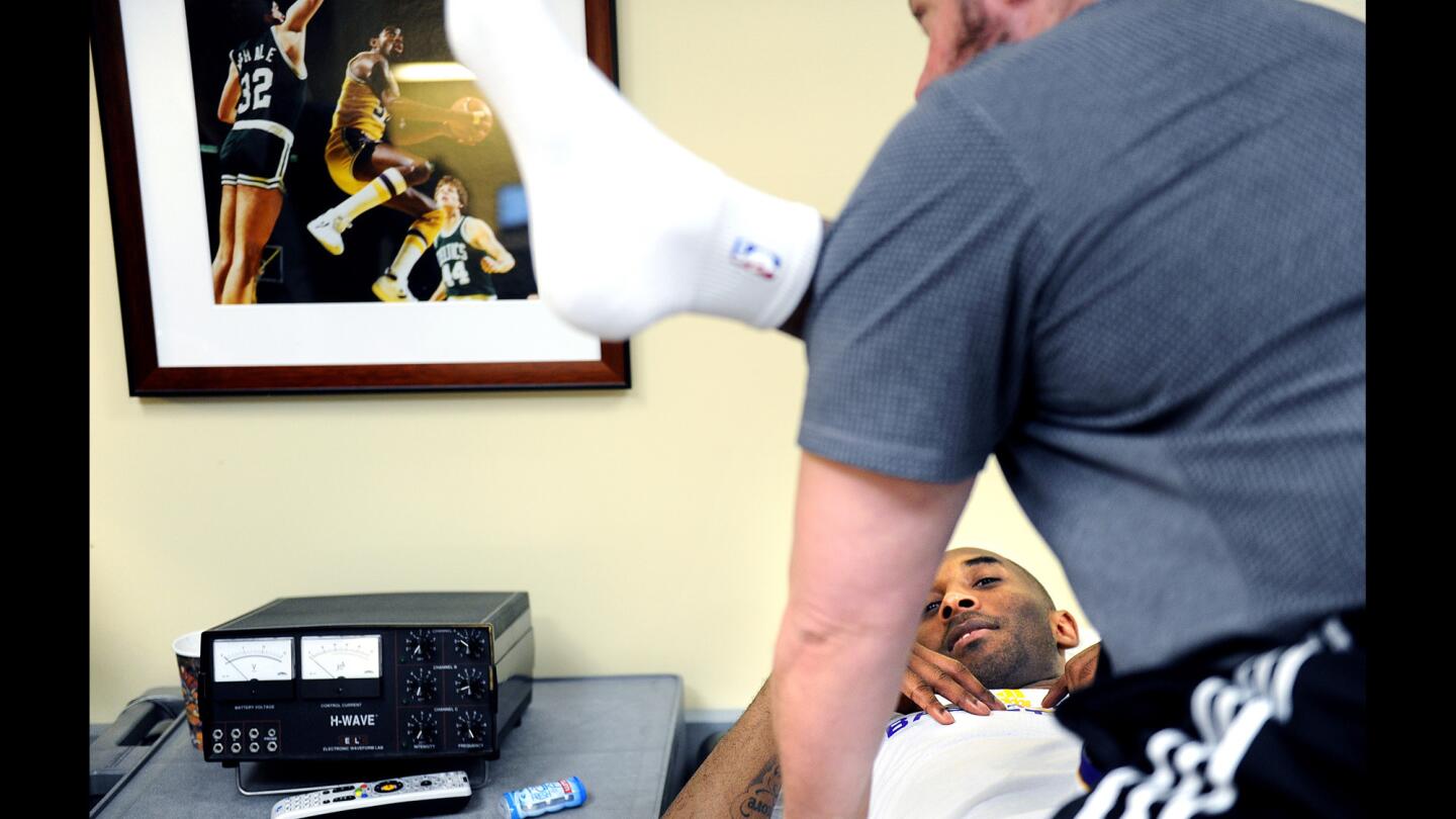 Lakers Kobe Bryant goes through a stretching exercise before a game with the Knicks at the Staples Center.