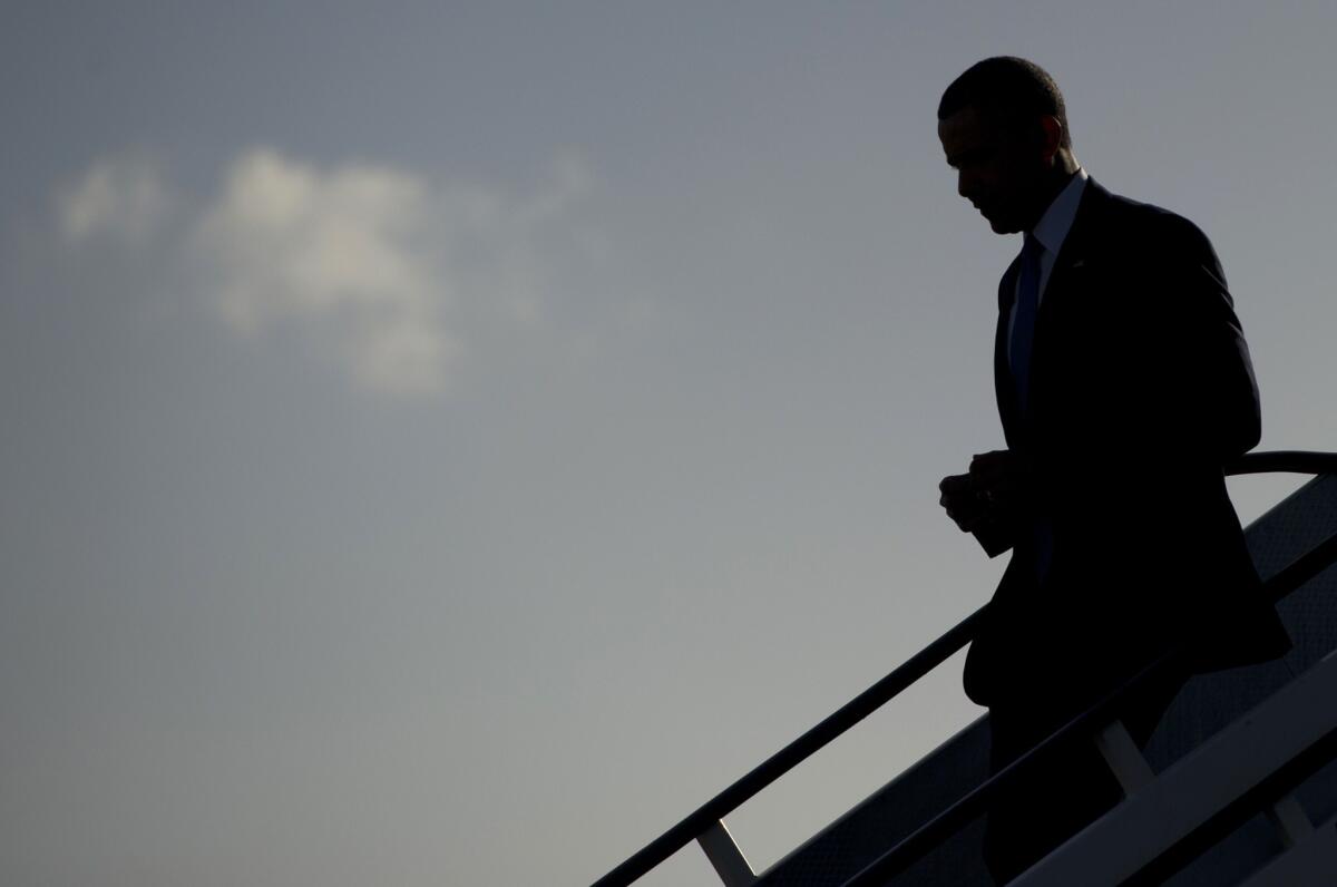 President Obama disembarks from Air Force One upon arrival at Amsterdam Schiphol International Airport as he begins a week-long trip to the Netherlands, Belgium, Italy and Saudi Arabia.