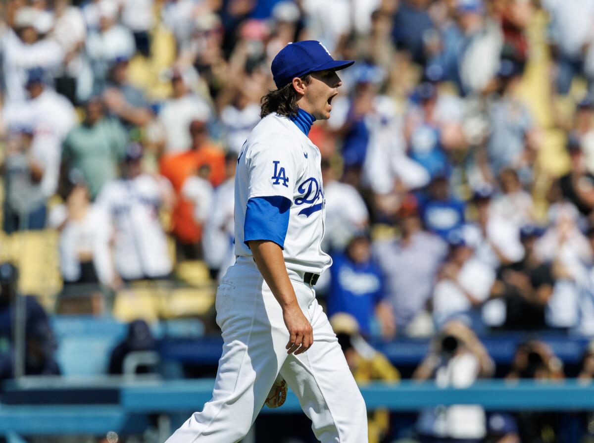 Dodgers relief pitcher Brent Honeywell reacts after getting his first career save on Thursday against the Giants.