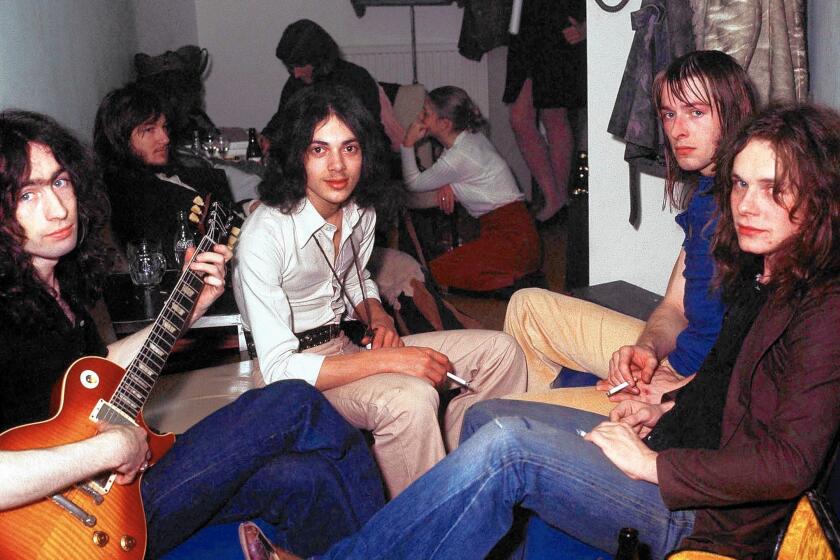 Members of the British blues-rock band Free gather backstage in 1972. From left are singer Paul Rodgers, bassist Andy Fraser, drummer Simon Kirke and guitarist Paul Kossoff.