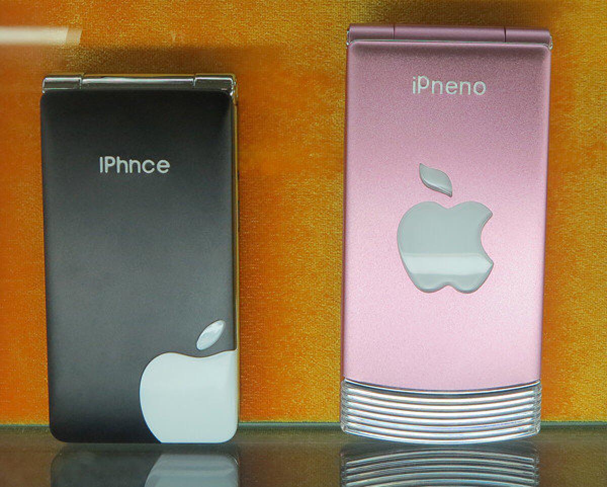 A display case of phony iPhones and other smartphones at an electronics bazaar in Shanghai.