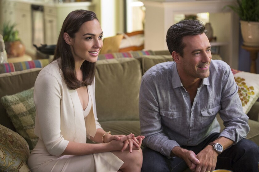 DF-06091R - The impossibly gorgeous and ultra-sophisticated newly-arrived suburban couple, Mr. and Mrs. "Jones" (Gal Gadot, Jon Hamm), are actually covert operatives. Photo Credit: Frank Masi, SMPSP.
