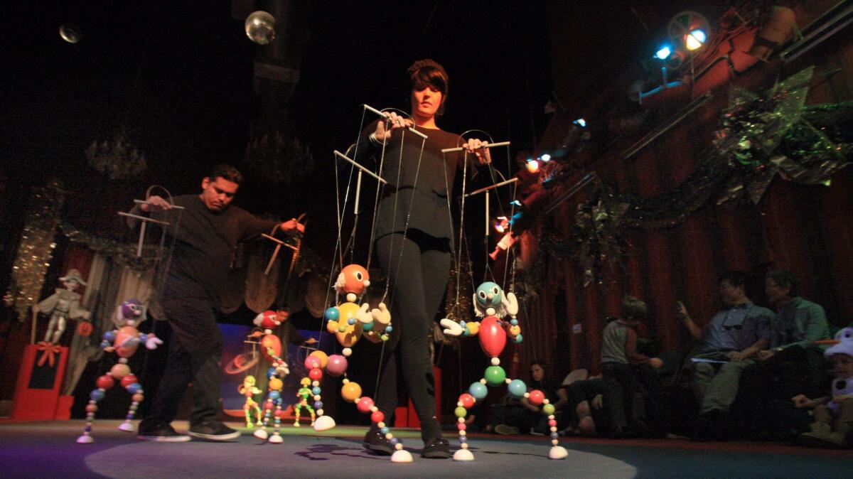 Puppeteers Victor Munoz and Suziey Block perform a Halloween puppet show at the Bob Baker Marionette Theater in 2014.