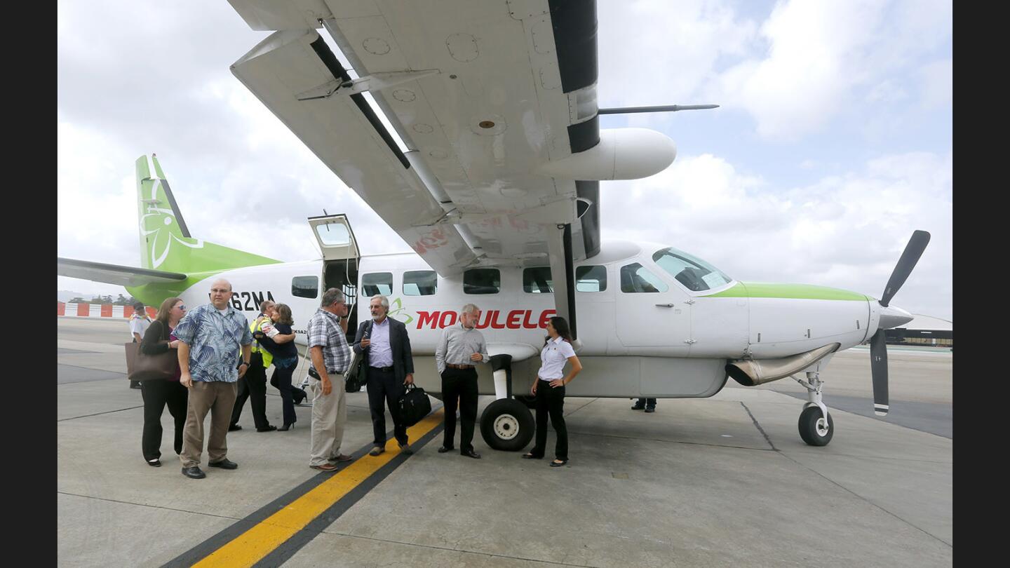 Passengers are greeted as they get off the inaugural Mokulele Airlines flight from Santa Maria to the Hollywood Burbank Airport, in Burbank on Tuesday, Oct. 3, 2017. The airline will serve the Burbank airport Monday through Friday with two daily flights, in the morning and afternoons. The airline also serves Los Angeles and the Imperial Valley in San Diego County.