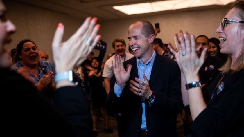 Rusty Hicks celebrates with supporters after winning the election for chairman of the California Democratic Party during the 2019 California State Democratic Party Convention at Moscone Center on Saturday in San Francisco.