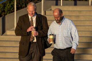 LOS ANGELES, CA - NOVEMBER 03: Defendant Jerry Boylan, right, captain of the Conception dive boat, arrives at Federal Court on Friday, Nov. 3, 2023 in Los Angeles, CA. (Irfan Khan / Los Angeles Times)