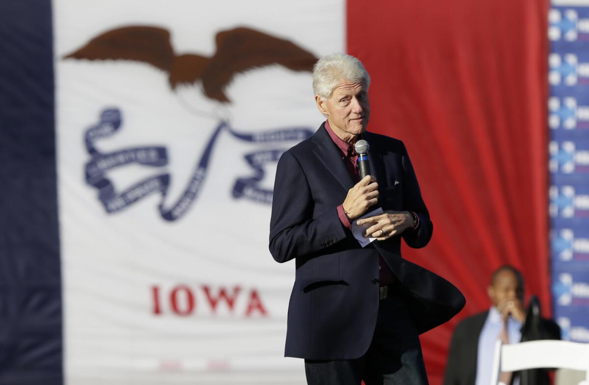 Former President Clinton speaks during a rally for his wife, Democratic presidential candidate Hillary Rodham Clinton, before the Iowa Democratic Party's Jefferson-Jackson Dinner in Des Moines.