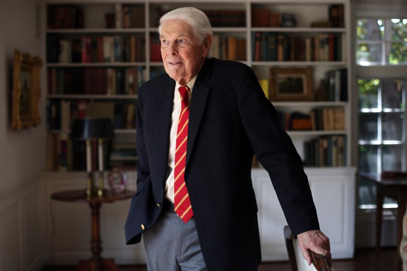 LOS ANGELES, CA - MAY 13, 2020: Tom Capehart, an 85 year-old graduating senior athlete from USC, poses for a portrait at home in Pasadena on May 13, 2020 in Los Angeles, California. He left school in 1956 and returned this spring to finish his las two credits. (Dania Maxwell / Los Angeles Times)
