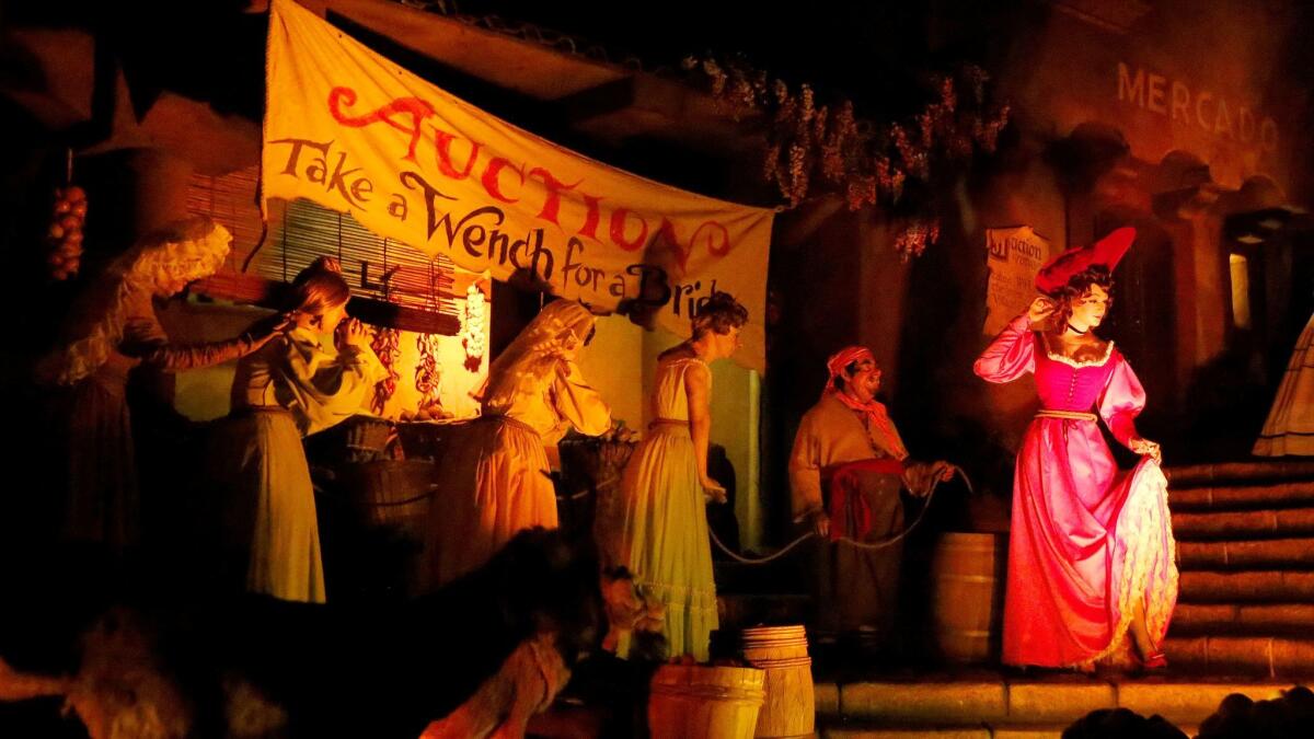 Women are sold at auction in the Pirates of the Caribbean ride at Disneyland in Anaheim. The scene is being removed and "the Redhead" reimagined as a loot-plundering pirate.