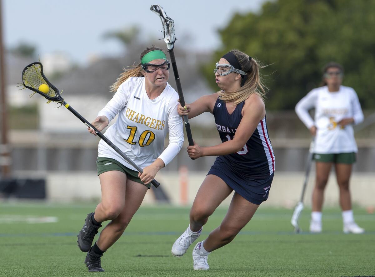 Edison High's Annie Cavener gets pressure from Yorba Linda's Cierra Taylor in a nonleague match on Thursday.