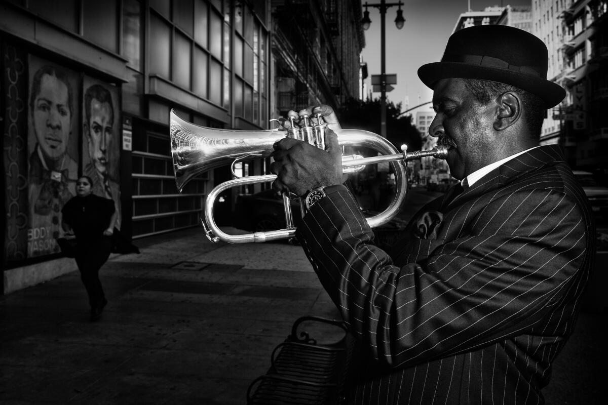 Billy Coates playing jazz near 9th and Broadway, as a woman runs to catch her bus.