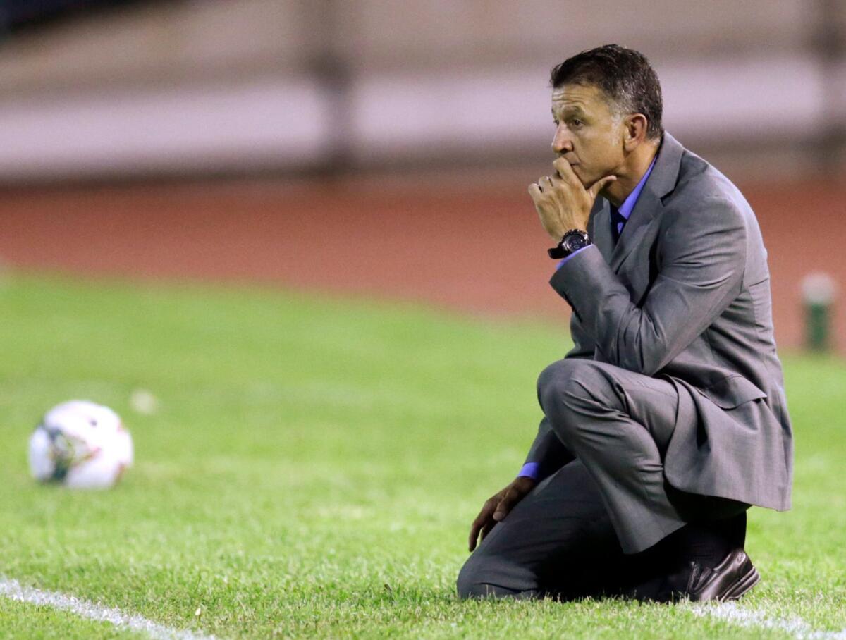 Colombia's Atletico Nacional coach Juan Carlos Osorio observes the game from the sidelines during a Aug. 2014 Copa Sudamericana soccer match against Venezuela's Deportivo La Guaira.