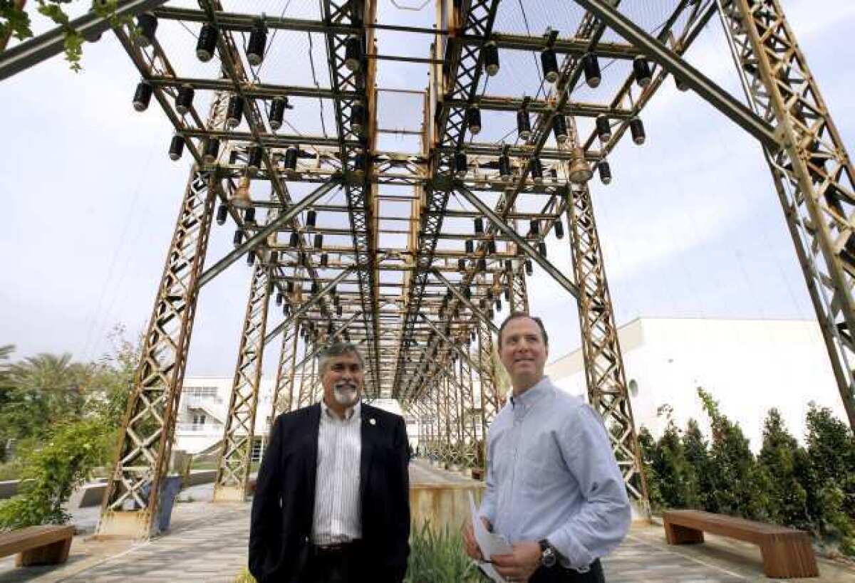 Rep. Adam Schiff (D-Burbank), right, tours the Burbank Water & Power EcoCampus, with Burbank Councilman Jess Talamantes, left, in March. A state renewable energy law is expected to cost Burbank $17.8 million this fiscal year.