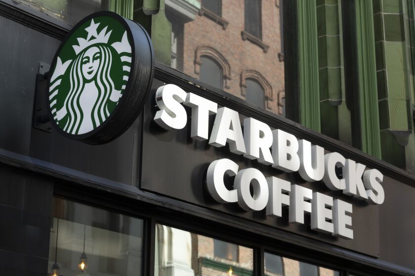 FILE - The Starbucks logo is seen on a storefront, Friday, Oct. 14, 2022, in Boston Starbucks reports financial earnings on Thursday, Feb. 2, 2023. (AP Photo/Michael Dwyer, File)