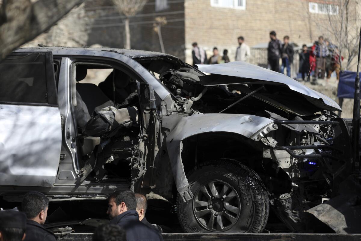 The twisted, burned out remains of an armored police SUV that was struck by a bomb in Kabul, Afghanistan, killing two.