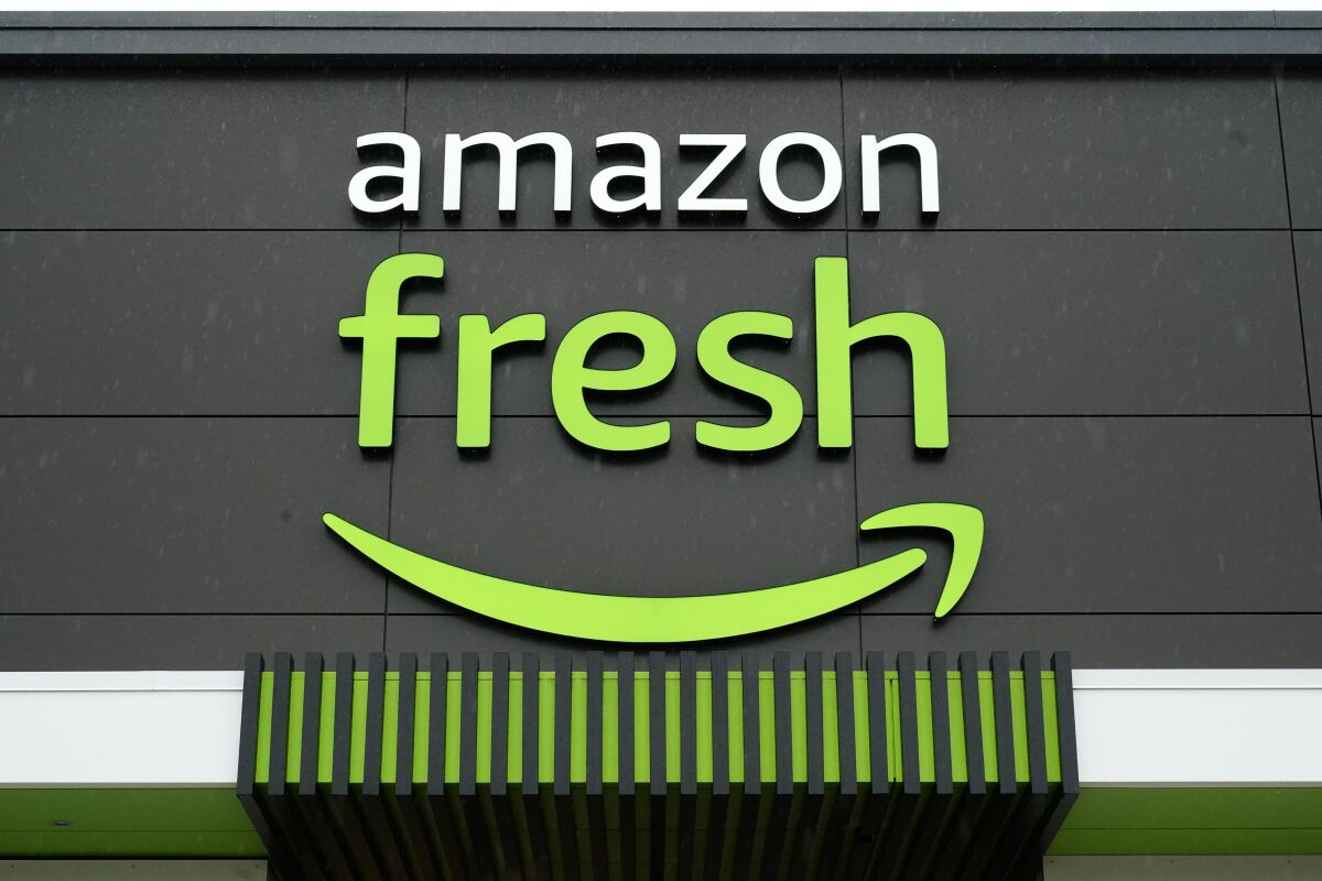 FILE - An Amazon Fresh grocery store stands in Warrington, Pa., on Feb. 4, 2022. In an email to Prime members Friday, Jan. 27, 2023, Amazon said that they are axing free grocery delivery for Prime members on orders less than $150. (AP Photo/Matt Rourke, File)