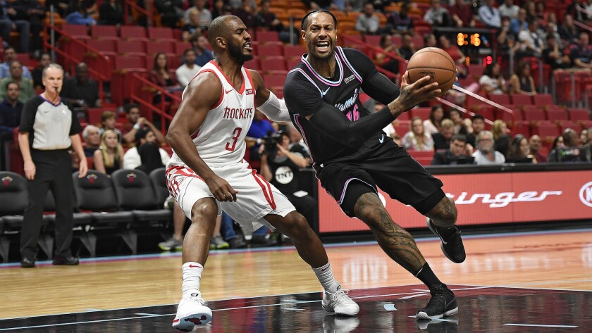 Rockets Lose Chris Paul Heat Escape With 101 99 Victory Los Angeles Times