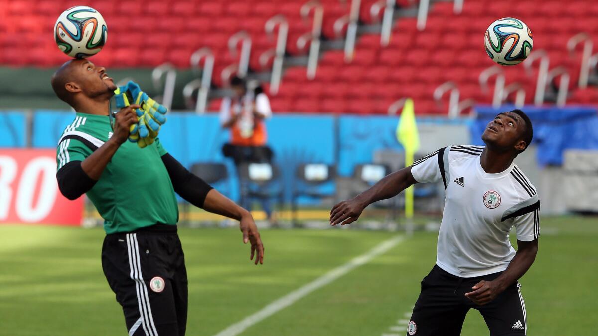 Nigeria teammates Vincent Enyeama, left, and Emmanuel Emenike take part in a team practice session Tuesday in preparation for Wednesday's match against Argentina.