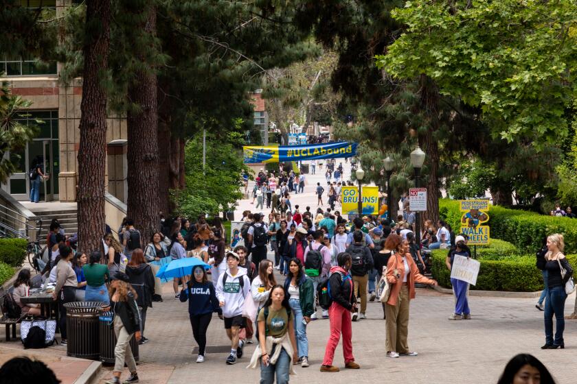 Los Angeles, CA - May 17: Signage and people along Bruin Walk East, approaching Bruin Plaza, on the UCLA Campus in Los Angeles, CA, Wednesday, May 17, 2023. (Jay L. Clendenin / Los Angeles Times)