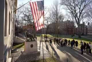 FILE - People take photos near a John Harvard statue, left, on the Harvard University campus, Tuesday, Jan. 2, 2024, in Cambridge, Mass. On Wednesday, Jan. 10, several Jewish students filed a lawsuit against Harvard University, accusing it of becoming “a bastion of rampant anti-Jewish hatred and harassment.” (AP Photo/Steven Senne, File)