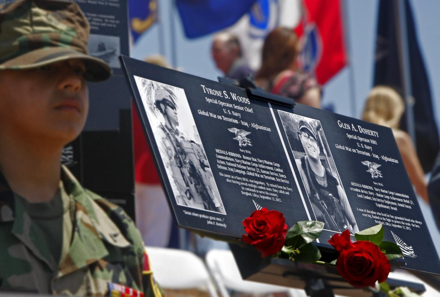 Plaques honoring Tyrone Woods and Glen Doherty are displayed at the Mt. Soledad memorial in San Diego. The former Navy SEALs were working as security contractors when they were killed in an attack near a U.S. diplomatic compound in Benghazi, Libya.