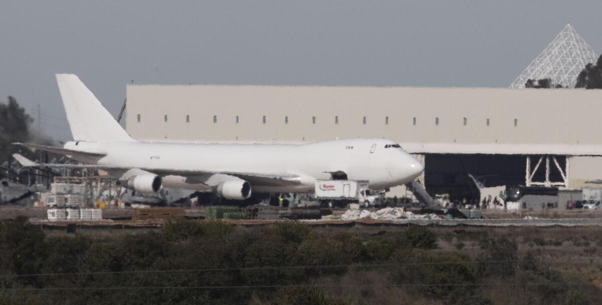 A charter plane with 167 Americans returning from China lands at Marine Corps Air Station Miramar on Wednesday morning.