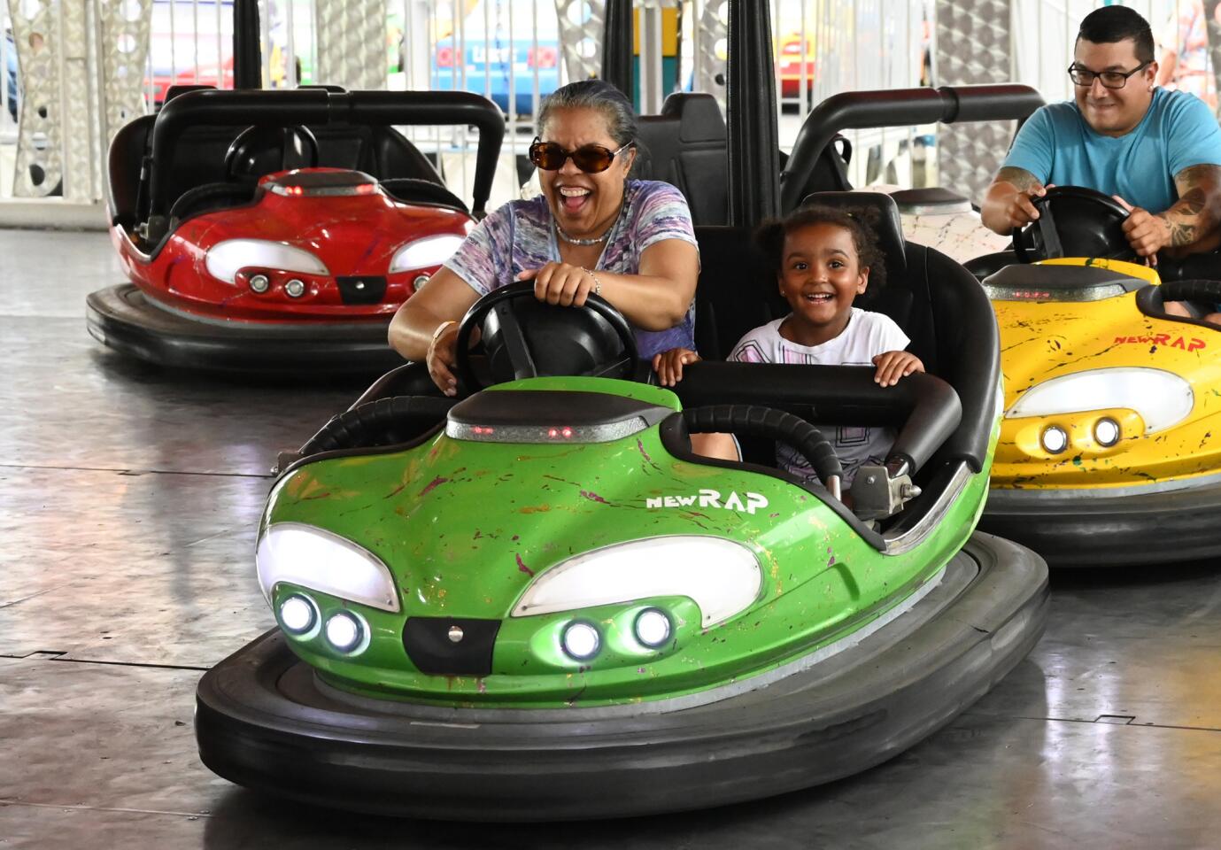 Diane Correia of Owings Mills and her 4-year-old granddaughter Aaliyah enjoy a ride in a bumper car while trying to elude pressure from other cars during the carnival at Reese & Community Volunteer Fire Company on Tuesday, July 16.